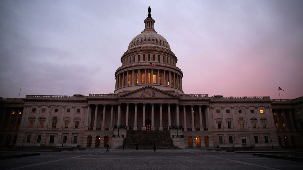 WASHINGTON, DC - MARCH 11: The American Flag flies over the Senate side of the U.S. Capitol, as Senate Democrats speak nonstop on the chamber floor about climate change on March 11, 2014 in Washington, DC. The self-titled 'climate caucus', a group of 26 senators working with a parallel House caucus, started speaking in the evening on March 10th and plan to continue until the morning of March 11th in an effort to elevate the issue of global warming. (Photo by Mark Wilson/Getty Images)