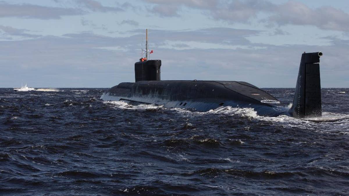 FILE - in this file photo taken on Thursday, July 2, 2009,  the Russian nuclear submarine, Yuri Dolgoruky, is seen during sea trials near Arkhangelsk, Russia.  The Russian navy said in a statement Friday March 31, 2017,  that its submarines have increased combat patrols to the level last seen during the Cold War. (AP Photo/Alexander Zemlianichenko, File)