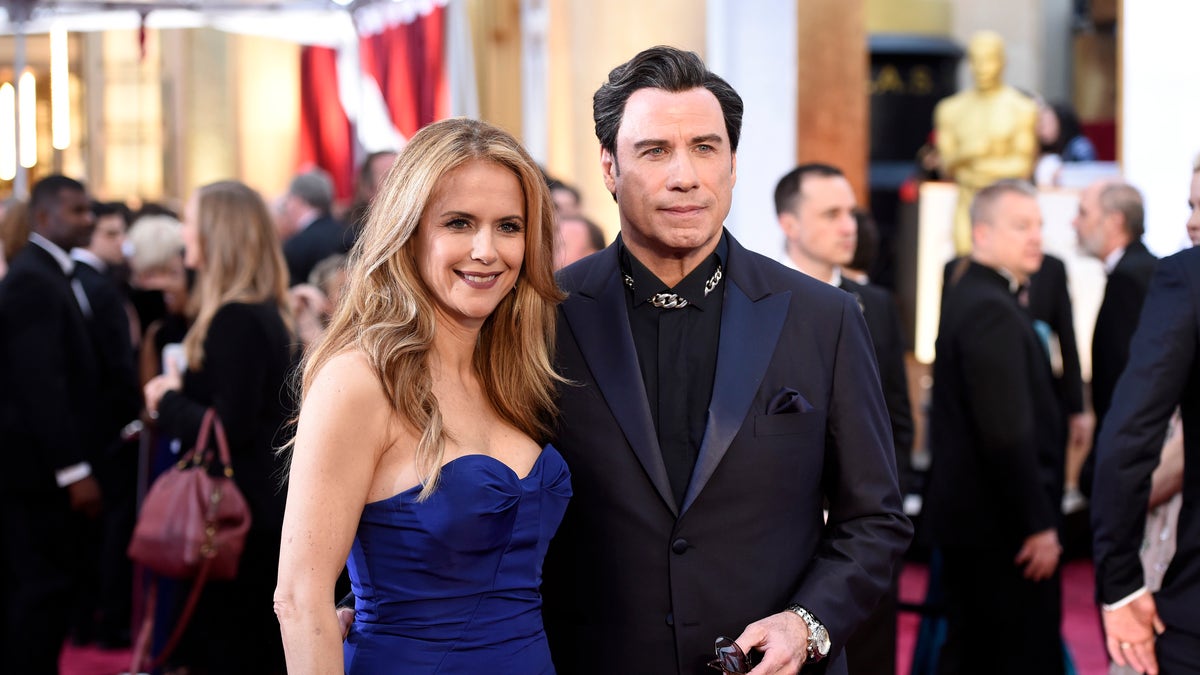 Kelly Preston and John Travolta attend the Oscars
