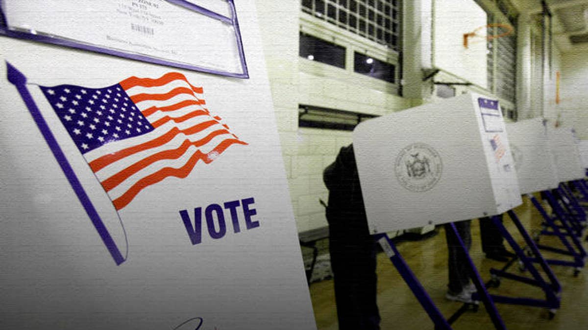 Voters cast their ballots in a school gym in New York's Harlem neighborhood, Tuesday, Nov. 2, 2010. (AP Photo/Richard Drew)