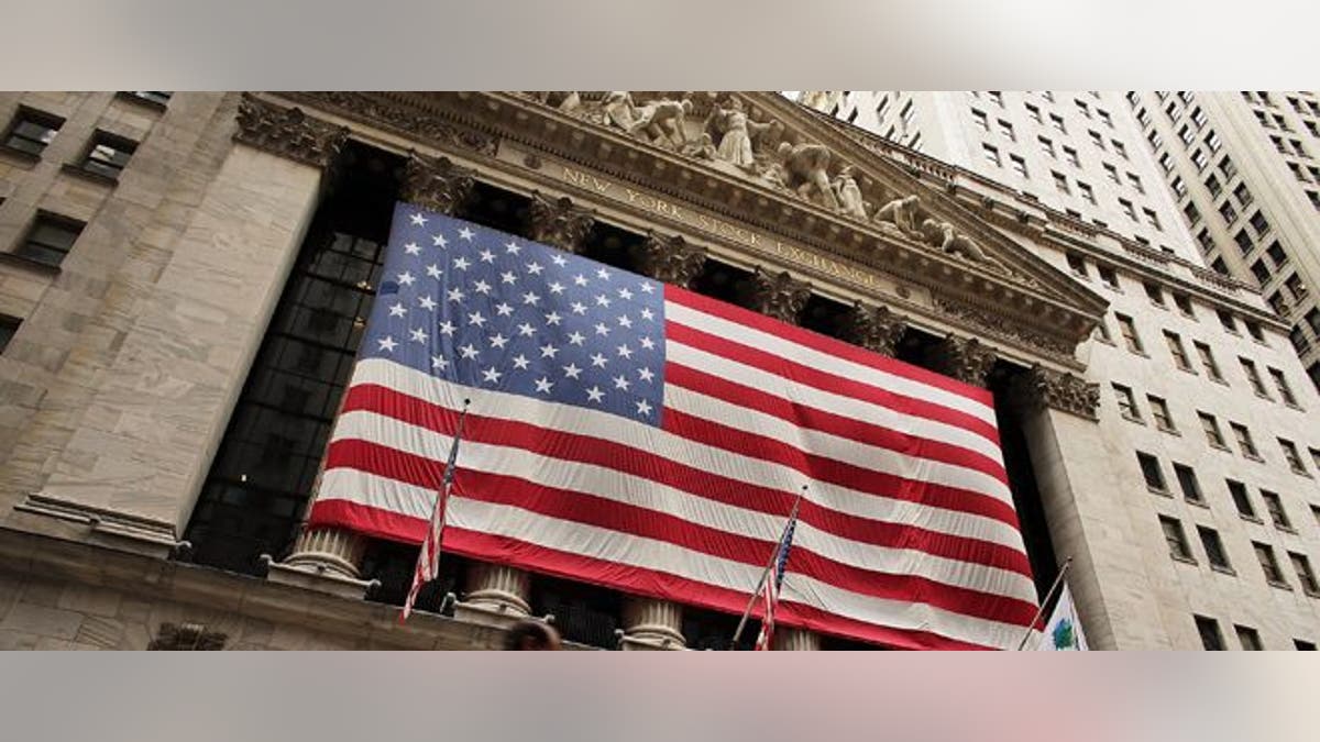 NEW YORK, NY - SEPTEMBER 06:  A man walks by the New York Stock Exchange on September 6, 2012 in New York City. Following news of a new European Central Bank bond-buying program and stronger-than-expected data on the job market ,The Dow Jones industrial average rose 245 points, or 1.9% to close at the highest level since December 2007.  (Photo by Spencer Platt/Getty Images)