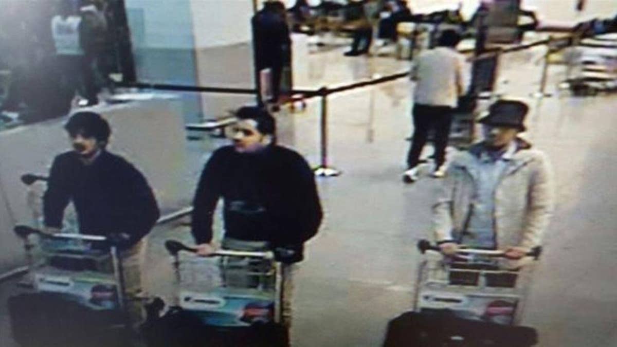 A surveillance image taken at the Zaventem airport before the attack. The men believed to be the suicide bombers, on the left, wore gloves on their left hands.