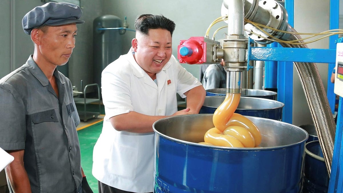 North Korean leader Kim Jong Un smiles during a visit to the Chonji Lubricant Factory, in this undated photo released by North Korea's Korean Central News Agency (KCNA) in Pyongyang August 6, 2014. REUTERS/KCNA (NORTH KOREA - Tags: POLITICS IMAGES OF THE DAY) ATTENTION EDITORS ? THIS PICTURE WAS PROVIDED BY A THIRD PARTY. REUTERS IS UNABLE TO INDEPENDENTLY VERIFY THE AUTHENTICITY, CONTENT, LOCATION OR DATE OF THIS IMAGE. FOR EDITORIAL USE ONLY. NOT FOR SALE FOR MARKETING OR ADVERTISING CAMPAIGNS. NO THIRD PARTY SALES. NOT FOR USE BY REUTERS THIRD PARTY DISTRIBUTORS. SOUTH KOREA OUT. NO COMMERCIAL OR EDITORIAL SALES IN SOUTH KOREA. THIS PICTURE IS DISTRIBUTED EXACTLY AS RECEIVED BY REUTERS, AS A SERVICE TO CLIENTS - GM1EA860SHW01