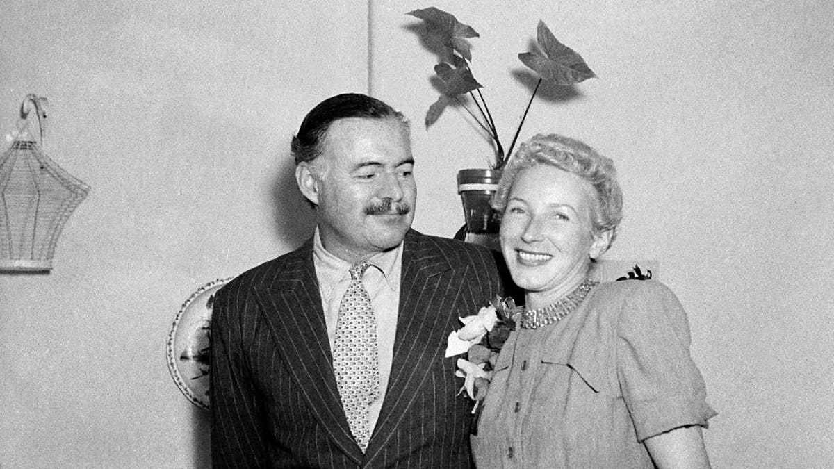 FILE - This March 14, 1946 file photo shows author Ernest Hemingway with his new wife, Mary Welsh, after their wedding in Havana, Cuba. Hemingway and John F. Kennedy never met, but the author's most extensive personal collection is housed at JFK's presidential library and is now on public display. The exhibition opening Monday, April 11, 2016, in Boston includes original manuscripts of some of his most famous literary works; letters to other major literary figures of his time; photographs and other personal mementos. (AP Photo, File)