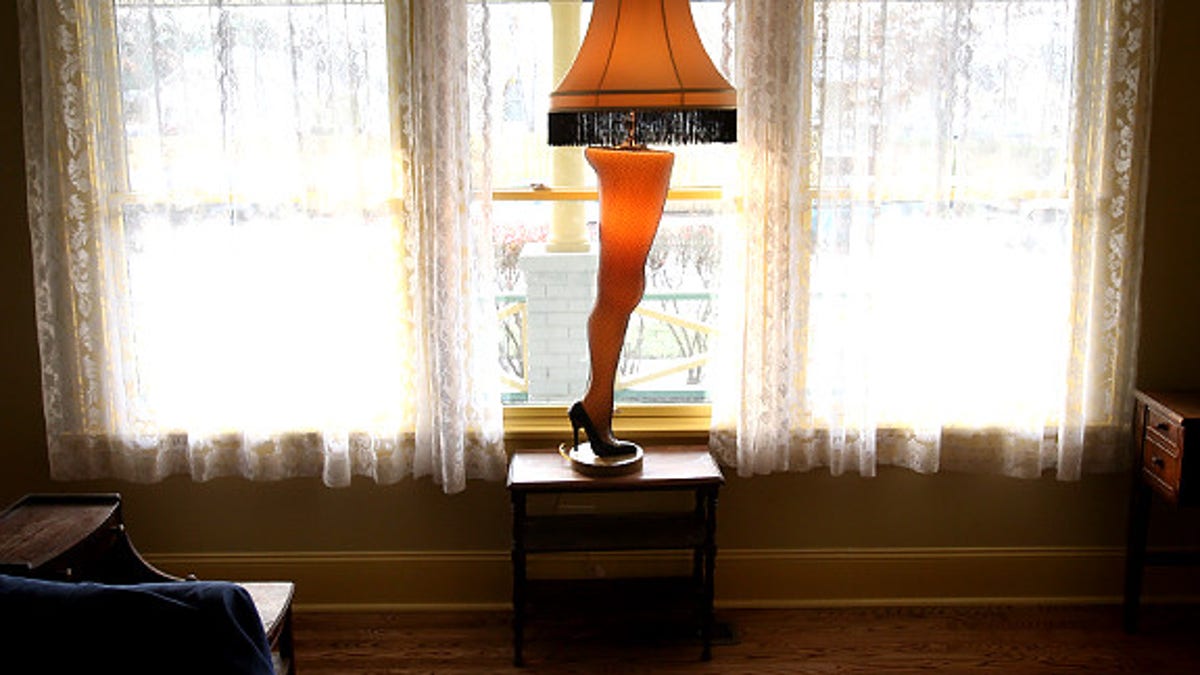 A leg lamp stands in the window Nov. 14, 2006, in the renovated Cleveland home that was used for the "A Christmas Story" movie. Brian Jones has restored the three-story, wood-frame house to its appearance in the movie and will open it for tours beginning Saturday. (AP Photo/The Plain Dealer, Scott Shaw) Original Filename: FILM_CHRISTMAS_STORY_HOUSE_OHCLE103.jpg