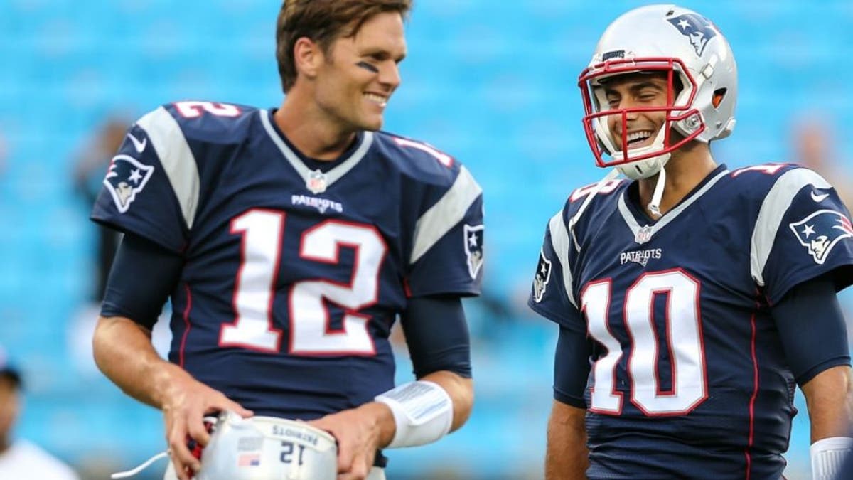 Aug 26, 2016; Charlotte, NC, USA; New England Patriots quarterback Tom Brady (12) and quarterback Jimmy Garoppolo (10) during warm ups at Bank of America Stadium. Mandatory Credit: Jim Dedmon-USA TODAY Sports