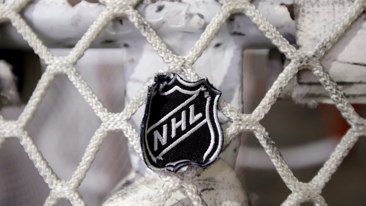 FILE - In this file photo taken Sept. 17, 2012, the NHL logo is seen on a goal at a Nashville Predators practice rink in Nashville, Tenn. The NHL eliminated 16 more days from the regular-season schedule Monday, Dec. 10, 2012, and if a deal with the players' association isn't reached soon the whole season could be lost. The league wiped out all games through Dec. 30 in its latest round of cancellations. Negotiations between the league and the players' association broke off last week, but NHL deputy commissioner Bill Daly said Sunday the sides are trying to restart talks this week. (AP Photo/Mark Humphrey, file)