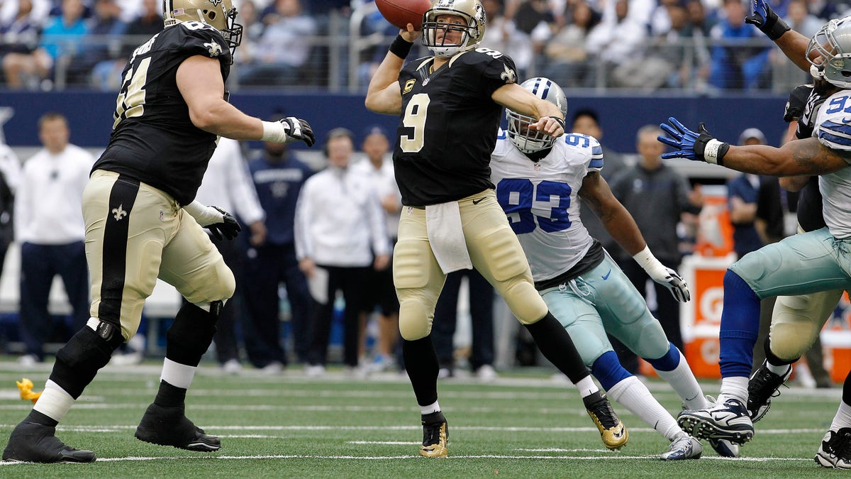 New Orleans Saints quarterback Drew Brees (9) passes the ball against the Dallas Cowboys during the first half of an NFL football game on Sunday, Dec. 23, 2012, in Arlington, Texas. (AP Photo/Brandon Wade)