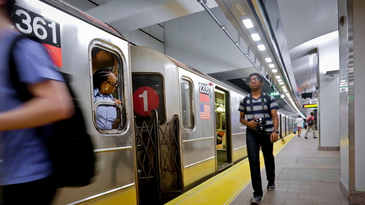 The No. 1 train prepares to leave the South Ferry Station, Tuesday June 27, 2017, in New York. The station reopened Tuesday, nearly five years after it was flooded by Superstorm Sandy in October 2012. (AP Photo/Bebeto Matthews)