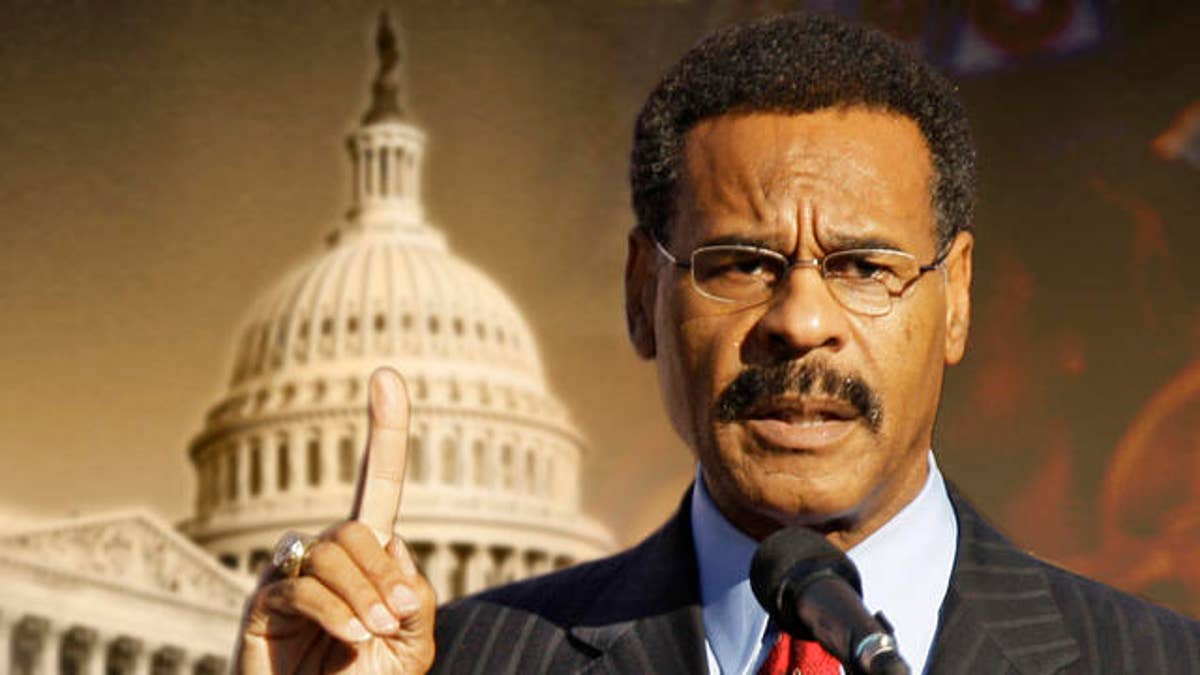 Rep. Emanuel Cleaver, D-Mo, addresses the crowd before a rally by Michelle Obama, wife of Democratic presidential candidate Sen. Barack Obama, D-Ill., in Kansas City, Mo. Wednesday, Oct. 1, 2008. (AP Photo/Charlie Riedel)
