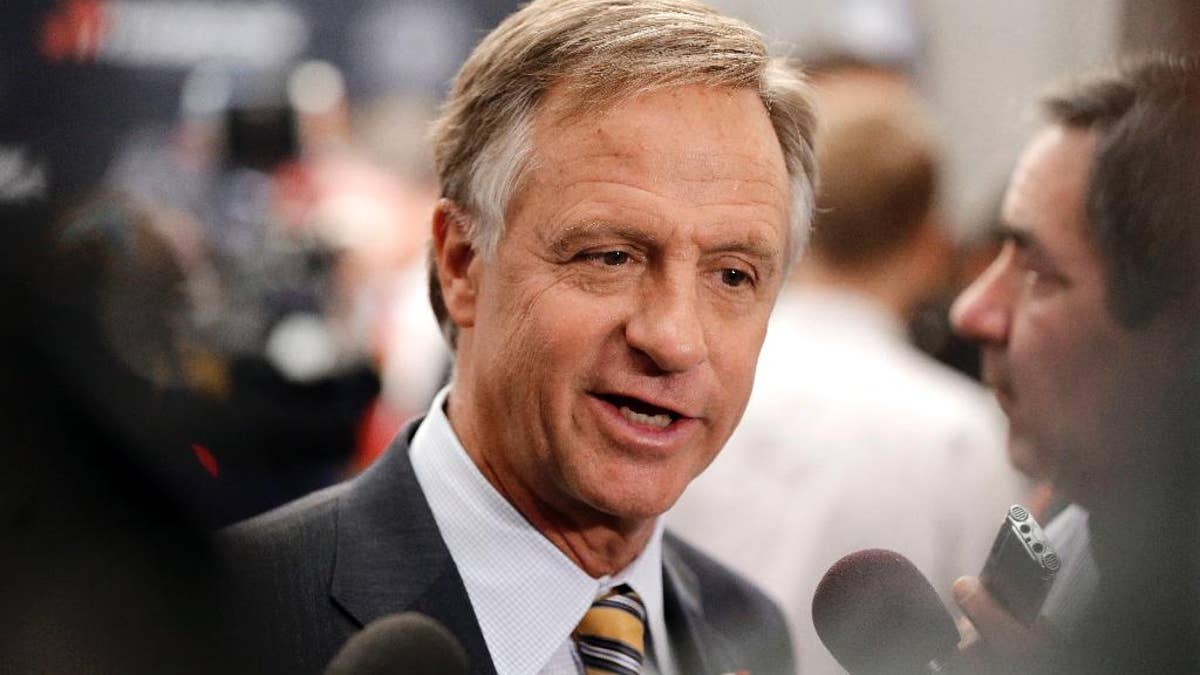 In this April 13, 2016 photo, Tennessee Gov. Bill Haslam talks with reporters in Nashville, Tenn. Haslam vetoed a bill that would make the Holy Bible the official book of Tennessee on Thursday, April 14, 2016. (AP Photo/Mark Humphrey)