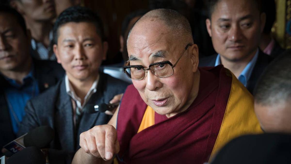 Tibetan spiritual leader the Dalai Lama, talks to the media after consecrating the Thupsung Dhargyeling Monastery in Dirang, Arunachal Pradesh, India, Thursday, April 6, 2017. The Dalai Lama consecrated the Buddhist monastery on Thursday in India's remote northeast, amid Chinese warnings that the exiled Tibetan spiritual leader's visit to the disputed border region would damage bilateral relations with India. (AP Photo/ Tenzin Choejor)