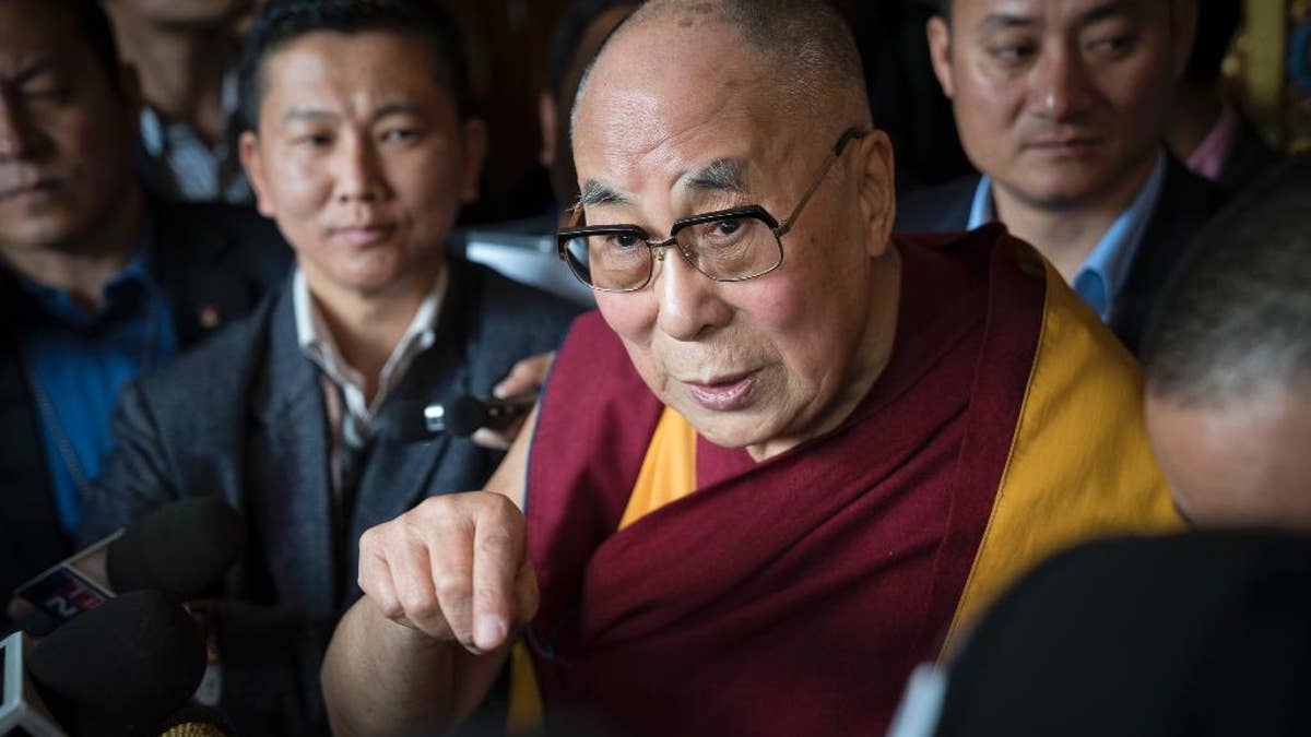 Tibetan spiritual leader the Dalai Lama, talks to the media after consecrating the Thupsung Dhargyeling Monastery in Dirang, Arunachal Pradesh, India, Thursday, April 6, 2017. The Dalai Lama consecrated the Buddhist monastery on Thursday in India's remote northeast, amid Chinese warnings that the exiled Tibetan spiritual leader's visit to the disputed border region would damage bilateral relations with India. (AP Photo/ Tenzin Choejor)