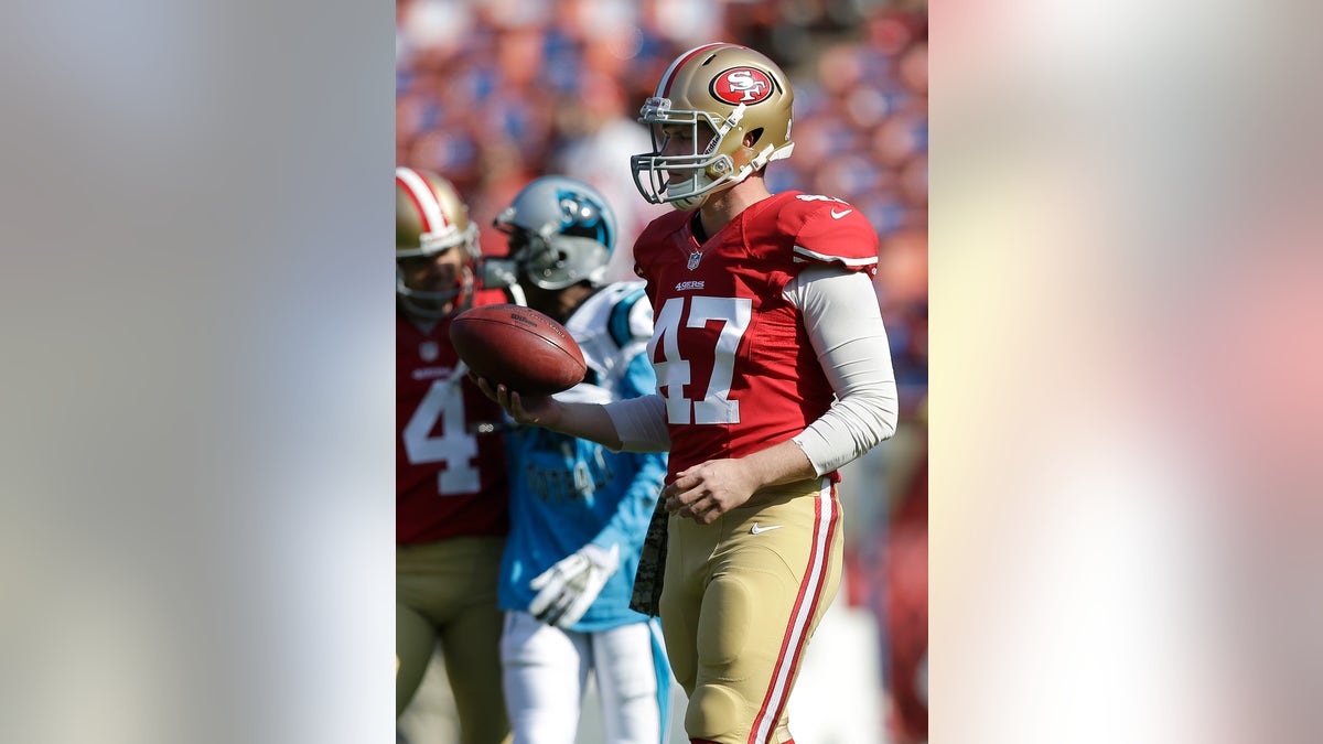 49ers McDermott Snaps Football