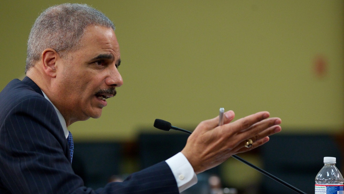  In this April 18, 2013 file photo, Attorney General Eric Holder testifies on Capitol Hill in Washington.  (AP Photo/Molly Riley, File)
