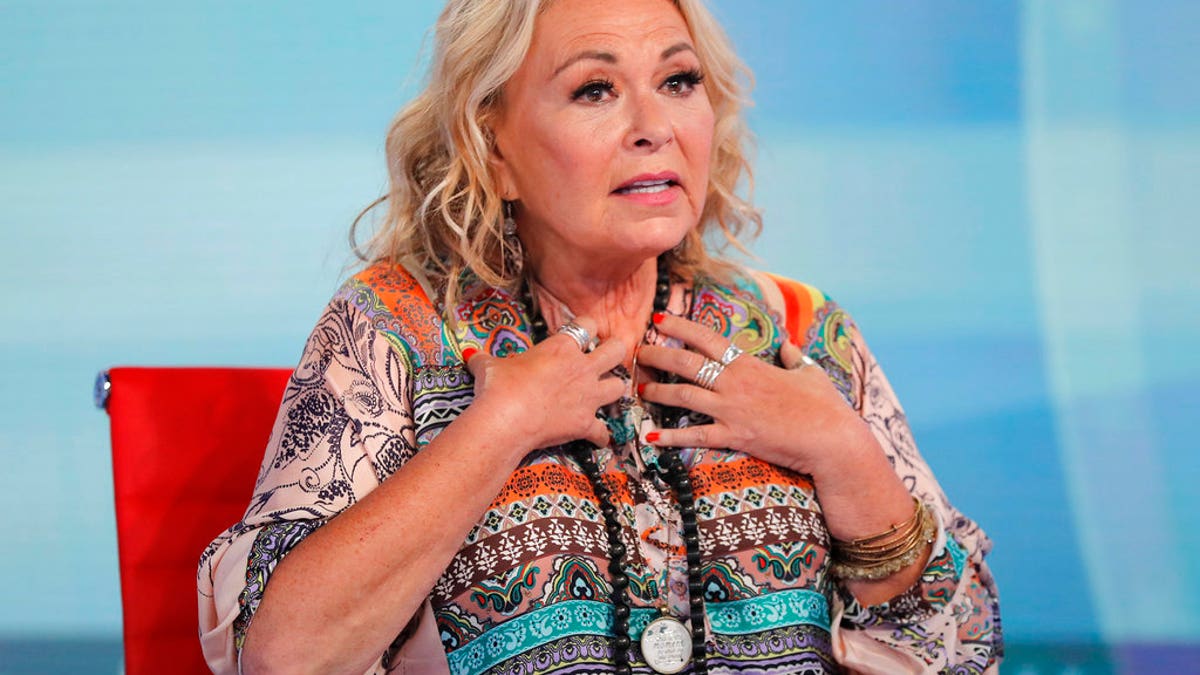 Roseanne Barr talks with Fox News talk show host Sean Hannity while being interviewed during a taping of his show, Thursday, July 26, 2018, in New York. The comedian and actress will appear on the Fox News show 