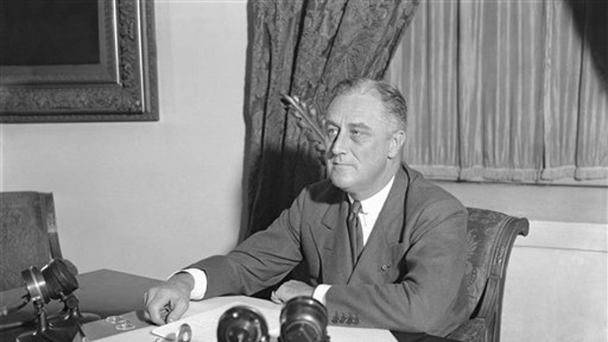 President Franklin D. Roosevelt is shown at his desk at the White House, May 7, 1933, when he outlined his ideas to the nation on a partnership between the government and agriculture, industry, and transportation. He announced measures to be proposed soon to give industrial workers a better deal. (AP Photo)