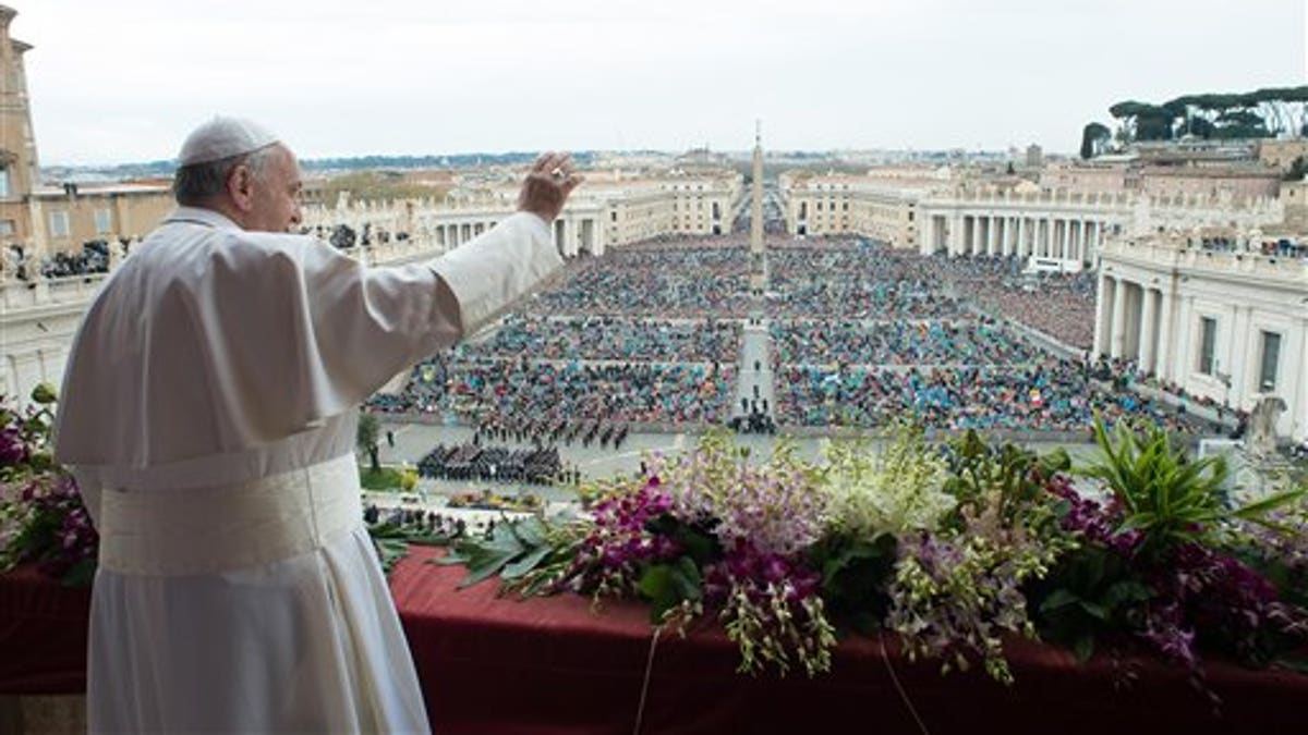 Pope Francis delivers the Urbi et Orbi (to the city and to the world) blessing at the end of the Easter Sunday Mass in St. Peter's Square at the Vatican , Sunday, April 5, 2015. In an Easter peace wish, Pope Francis on Sunday praised the framework nuclear agreement with Iran as an opportunity to make the world safer, while expressing deep worry about bloodshed in Libya, Yemen, Syria, Iraq, Nigeria and elsewhere in Africa. Cautious hope ran through Francis' "Urbi et Orbi" Easter message, a kind of papal commentary on the state of the world's affairs, which he delivered from the central balcony of St. Peter's Square. (AP Photo/L'Osservatore Romano, Pool)