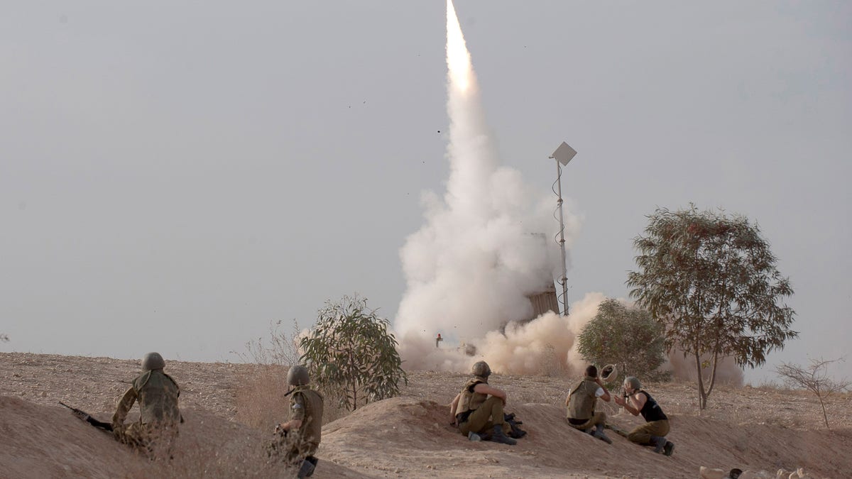 An Israeli Iron Dome missile is launched near the city of Be'er Sheva, southern Israel, to intercept a rocket fired from Gaza Saturday, Nov. 17, 2012. Israel bombarded the Hamas-ruled Gaza Strip with nearly 200 airstrikes early Saturday, the military said, widening a blistering assault on Gaza rocket operations to include the prime minister's headquarters, a police compound and a vast network of smuggling tunnels. (AP Photo/Ahikam Seri)