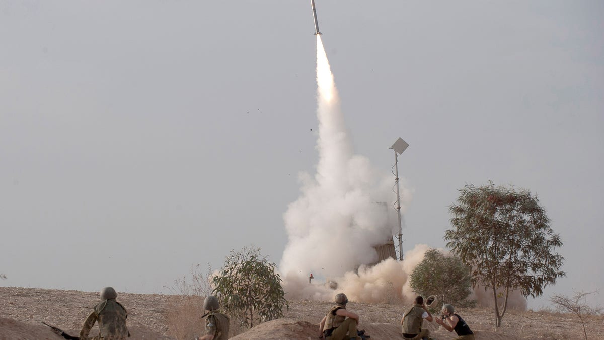 An Israeli Iron Dome missile is launched near the city of Be'er Sheva, southern Israel, to intercept a rocket fired from Gaza Saturday, Nov. 17, 2012. Israel bombarded the Hamas-ruled Gaza Strip with nearly 200 airstrikes early Saturday, the military said, widening a blistering assault on Gaza rocket operations to include the prime minister's headquarters, a police compound and a vast network of smuggling tunnels. (AP Photo/Ahikam Seri)
