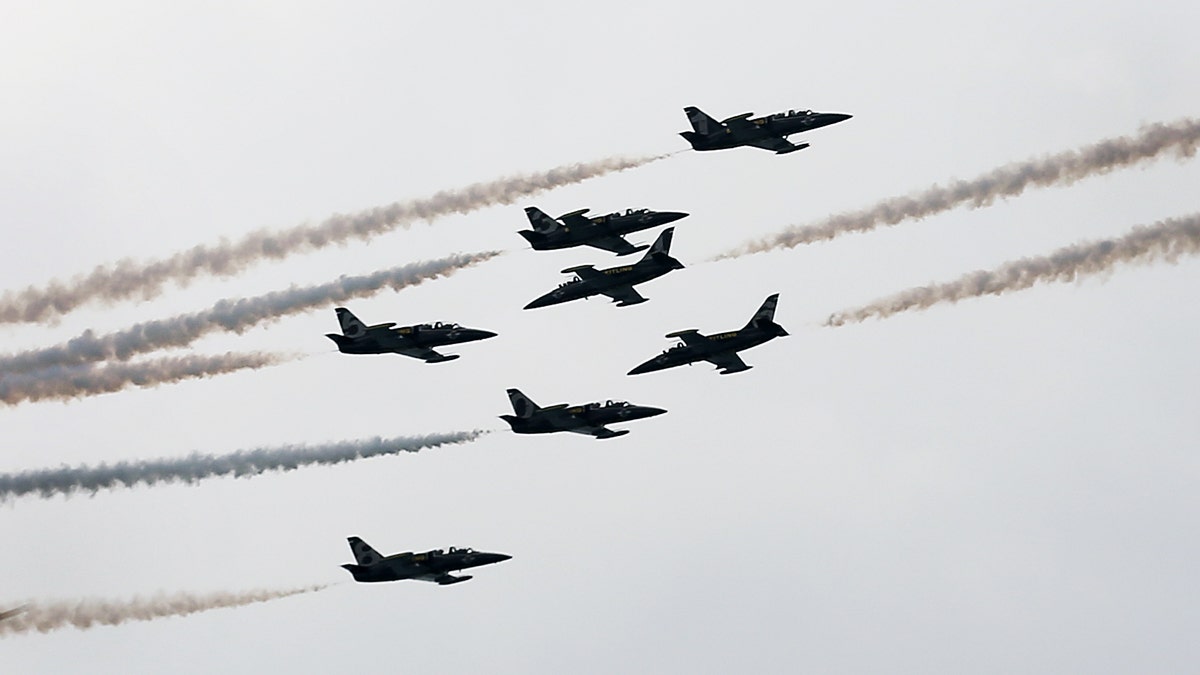 French Breitling Jet Team comprising of 7 Aero L-39 Albatross planes perform stunts during their Southeast Asian Tour aerobatics showcase on Saturday March 9, 2013 in Singapore. This is the first stop of their tour and the team will be showcasing their aerobatics performances in other countries such as the Philippines, Indonesia, Malaysia and Thailand.(AP Photo/Wong Maye-E)