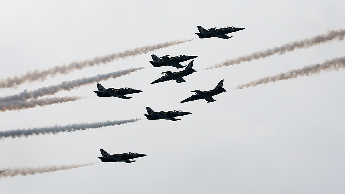 French Breitling Jet Team comprising of 7 Aero L-39 Albatross planes perform stunts during their Southeast Asian Tour aerobatics showcase on Saturday March 9, 2013 in Singapore. This is the first stop of their tour and the team will be showcasing their aerobatics performances in other countries such as the Philippines, Indonesia, Malaysia and Thailand.(AP Photo/Wong Maye-E)