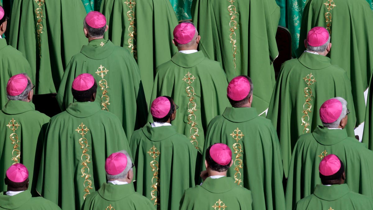 Bishops atend a mass celebrated by Pope Bemedict XVI marking the 50th anniversary of the Second Vatican Council, in St. Peter's Square at the Vatican, Thursday, Oct. 11, 2012. Benedict, after celebrating mass, will greet churchmen, including a dozen original Vatican II participants, re-enacting the great procession into St. Peter's that launched the council in 1962. . (AP Photo/Andrew Medichini)