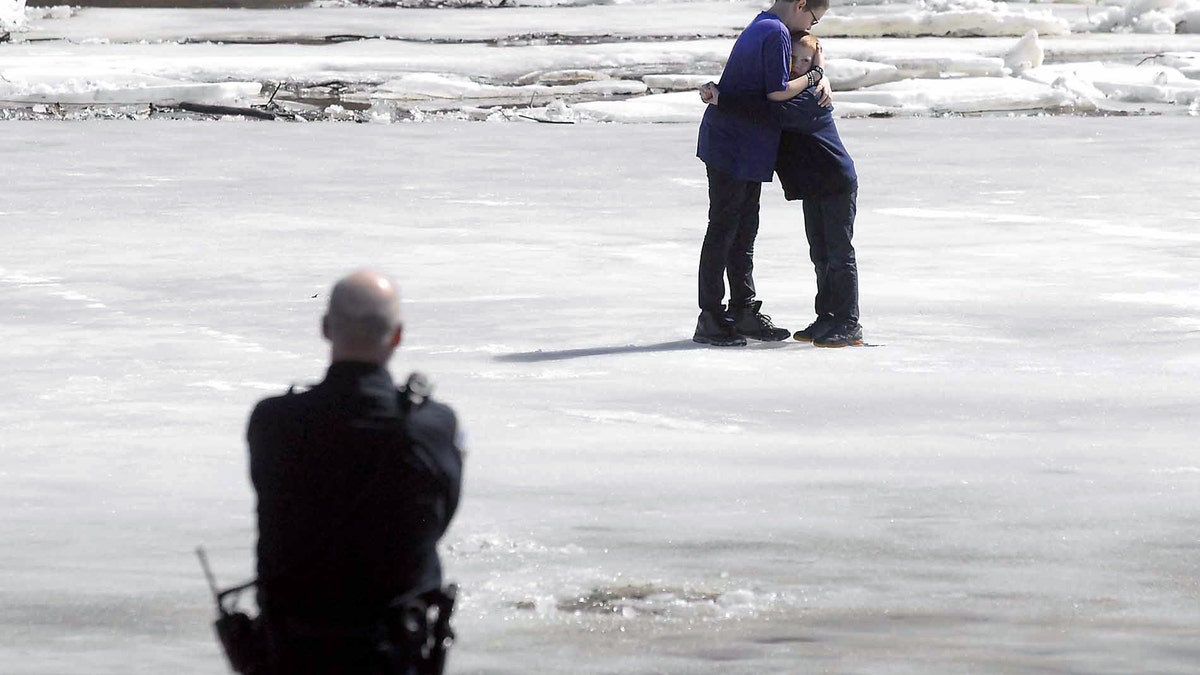 APTOPIX Ice Rescue Young Boys