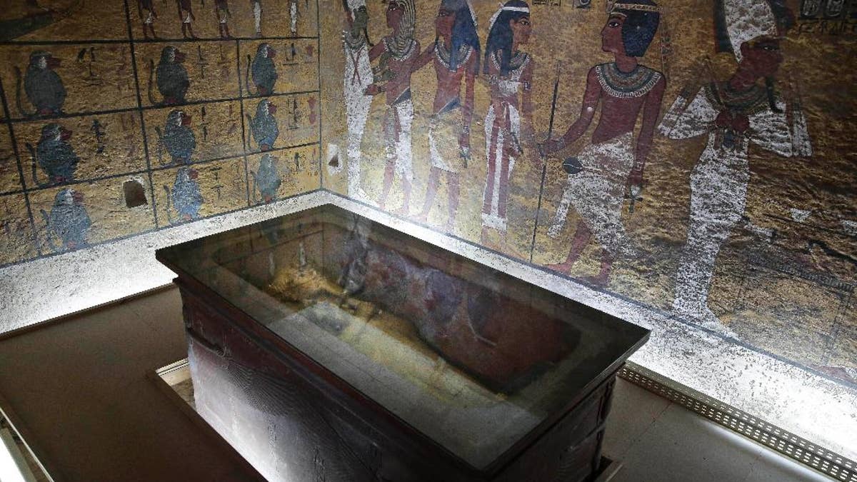 The tomb of King Tut is displayed in a glass case at the Valley of the Kings in Luxor, Egypt, Tuesday, Sept. 29, 2015. Egypt's antiquities minister said King Tut's tomb may contain hidden chambers, lending support to a British Egyptologist's theory that a queen may be buried in the walls of the 3,300 year-old pharaonic mausoleum. (AP Photo/Nariman El-Mofty)