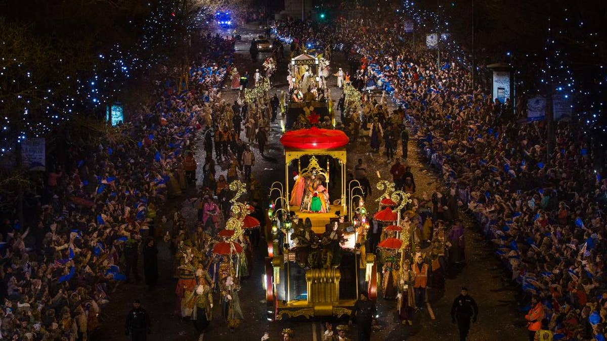 Kings' chariots march during the 'Cabalgata de Reyes,' or the Three Wise Men parade in Madrid, Monday, Jan. 5, 2015. The traditional parade marks the eve of the Epiphany, a Christian holiday celebrating the story of the three wise men believed to have followed a bright star to offer gifts of gold, frankincense and myrrh to the newborn Jesus in Bethlehem. (AP Photo/Andres Kudacki)