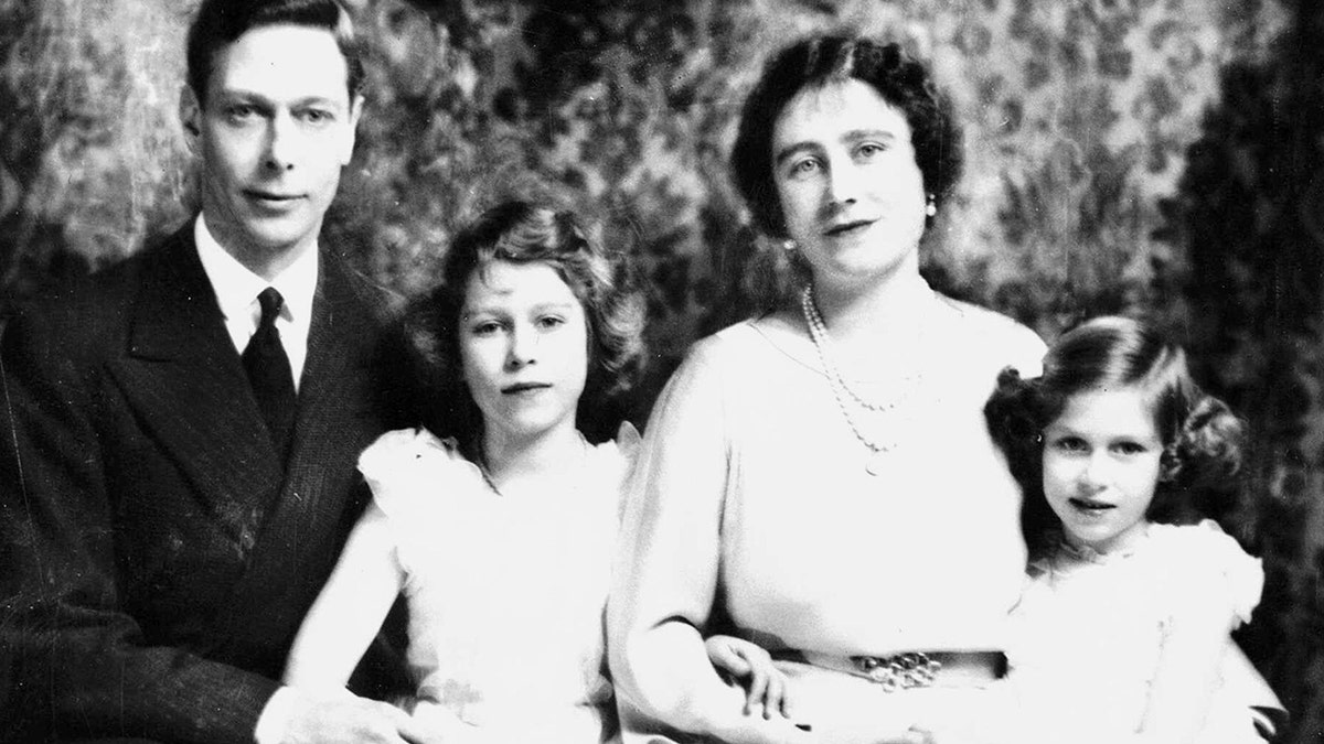 Prince George VI and Queen Mother Elizabeth with their children Princess Elizabeth, bottom right, and Princess Margaret.