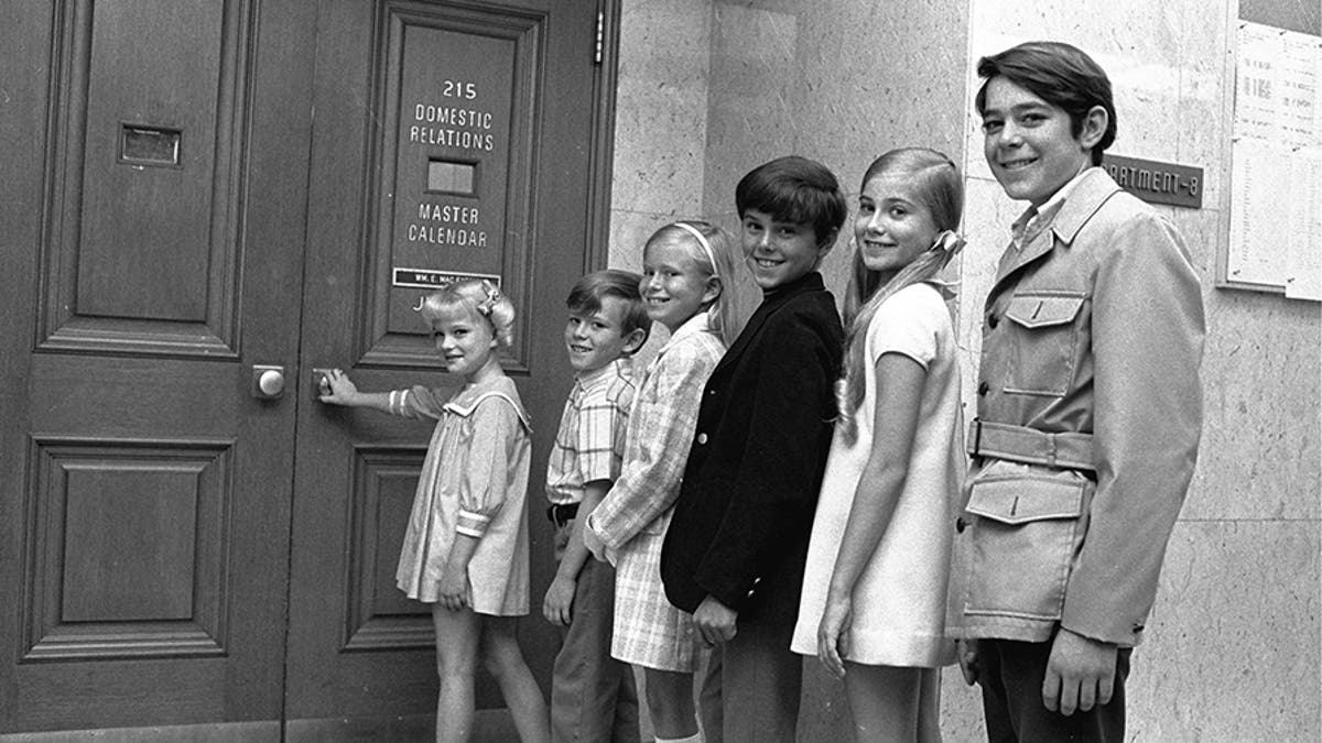 Six youngsters who only recently met line up outside a Los Angeles, Ca. courtroom June 18, 1969 to await approval of contracts calling for them to play brothers and sisters on a new television series.  The series, called 