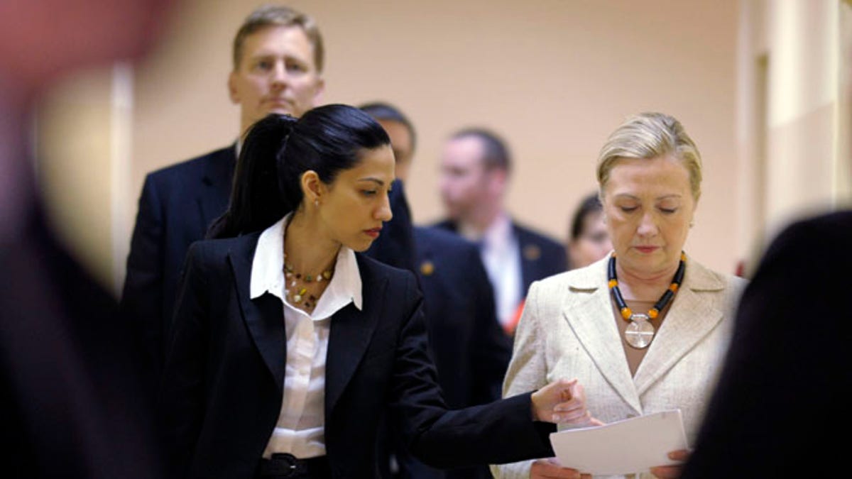 FILE: June 11, 2011: Huma Abedin with then-Secretary of State Hillary Clinton, Lusaka, Africa.
