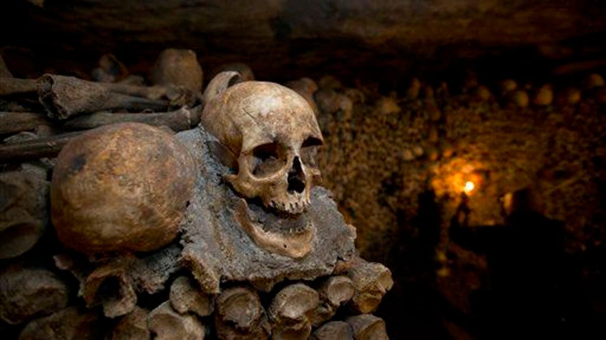 Skulls and bones are stacked at the Catacombs in Paris.