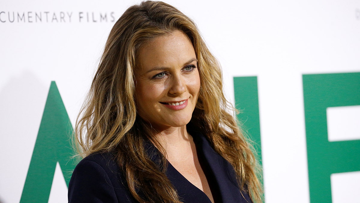 Actor Alicia Silverstone poses at the premiere for the documentary 