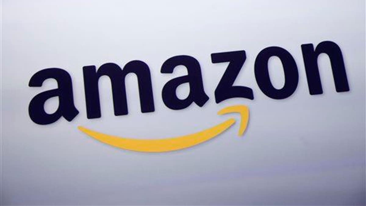 The Amazon.com logo is displayed at a news conference in New York.