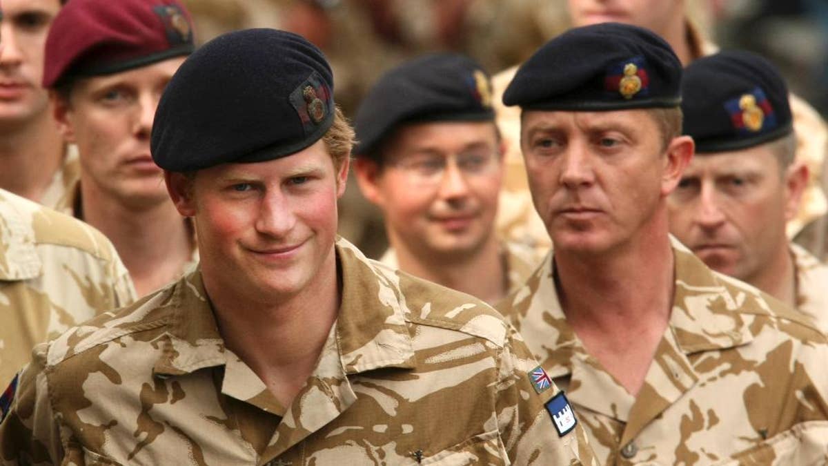 File-This May 5, 2008, file photo shows Britain's Prince Harry, left, arriving for a thanksgiving service at the Army Garrison Church in Windsor, England, after receiving a campaign medal for serving in Afghanistan. Prince Harry will be embedded in Australian army units on the north, west and east coasts of the country during the British royal's hectic four-week secondment to the Australian defense forces next month before he ends his decade-long military career, officials said Tuesday, March 17, 2015. (AP Photo/Matt Dunham, File)