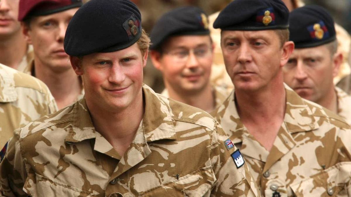 File-This May 5, 2008, file photo shows Britain's Prince Harry, left, arriving for a thanksgiving service at the Army Garrison Church in Windsor, England, after receiving a campaign medal for serving in Afghanistan. Prince Harry will be embedded in Australian army units on the north, west and east coasts of the country during the British royal's hectic four-week secondment to the Australian defense forces next month before he ends his decade-long military career, officials said Tuesday, March 17, 2015. (AP Photo/Matt Dunham, File)