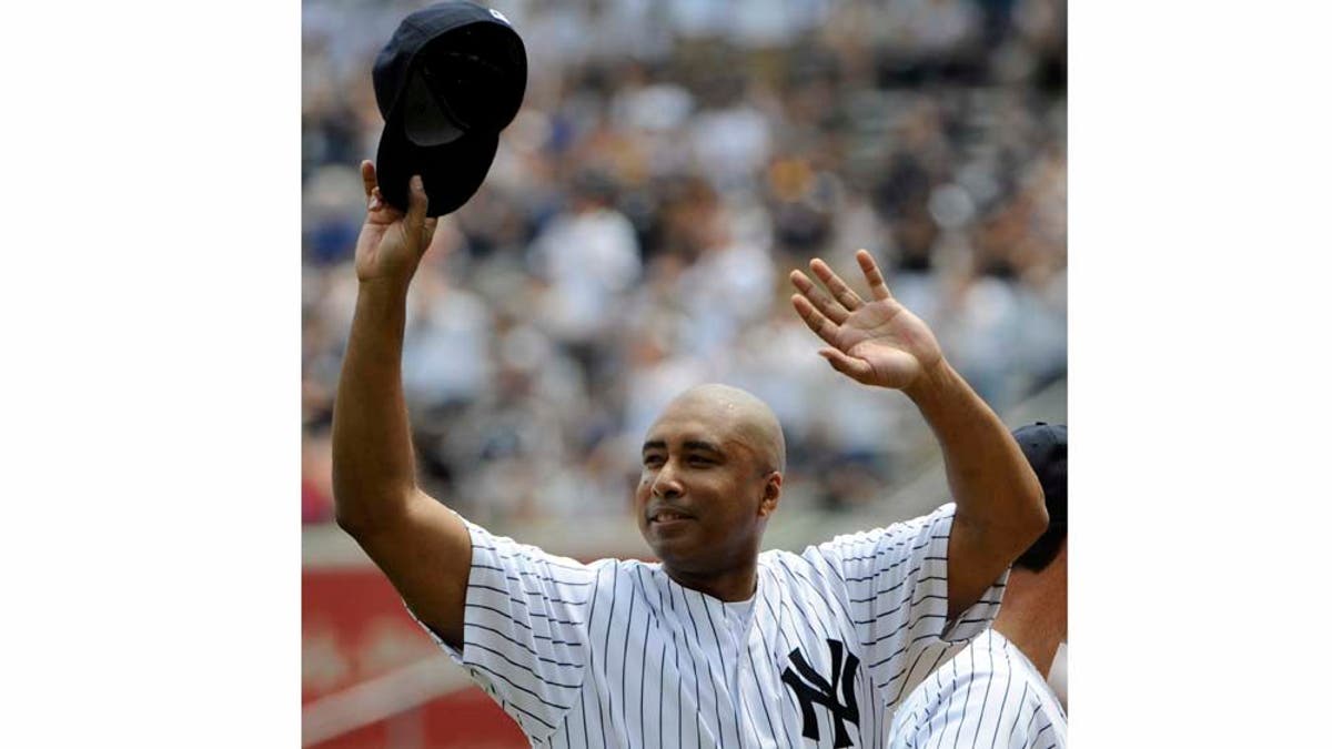 Former New York Yankees center fielder Bernie Williams reacts to applause during Old Timers' Day ceremonies on Sunday, June 26, 2011, at Yankee Stadium in New York. (AP Photo/Bill Kostroun)