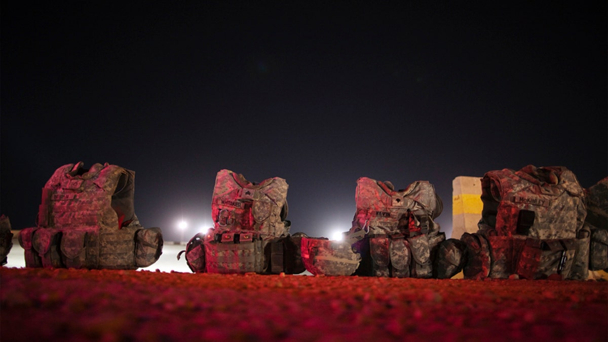 File photo - Sets of U.S. body armor rest on the ground near Nasiriyah, Iraq  Dec. 17, 2011. 