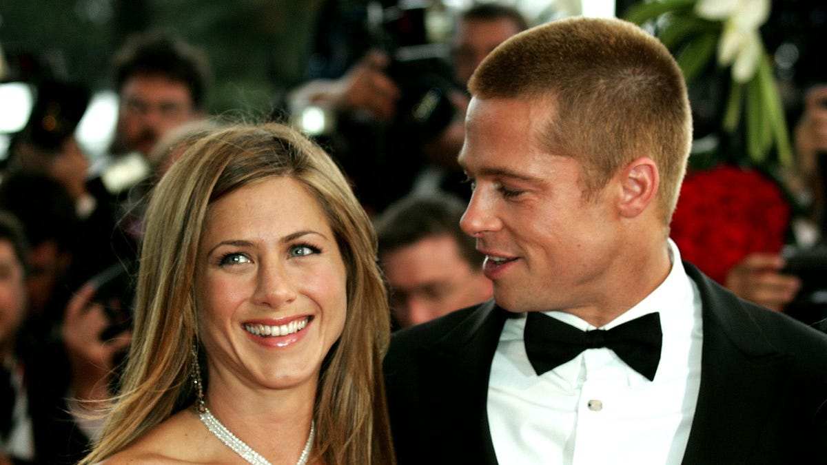 U.S. Actor Brad Pitt (L) escorts his wife U.S. actress Jennifer Aniston (R) during red carpet arrivals for the screening of [German director Wolfang Petersen's] 'Troy' at the 57th Cannes Film Festival, May 13, 2004.