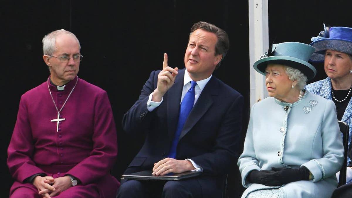 Seated near the Magna Carta memorial at Runnymede, England, are from left, The Archbishop of Canterbury Justin Welby, Prime Minister David Cameron, and Queen Elizabeth II, ahead of a commemoration ceremony Monday June 15, 2015, to celebrate the 800th anniversary of the groundbreaking accord called Magna Carta. In 1215, Britain's King John met disgruntled barons at Runnymede and agreed to a list of basic rights and laws which have formed the basic tenets of modern civil liberties which exist today, and was an inspiration for the U.S. Constitution among many other worldwide influences. (Steve Parsons / Pool photo via AP)
