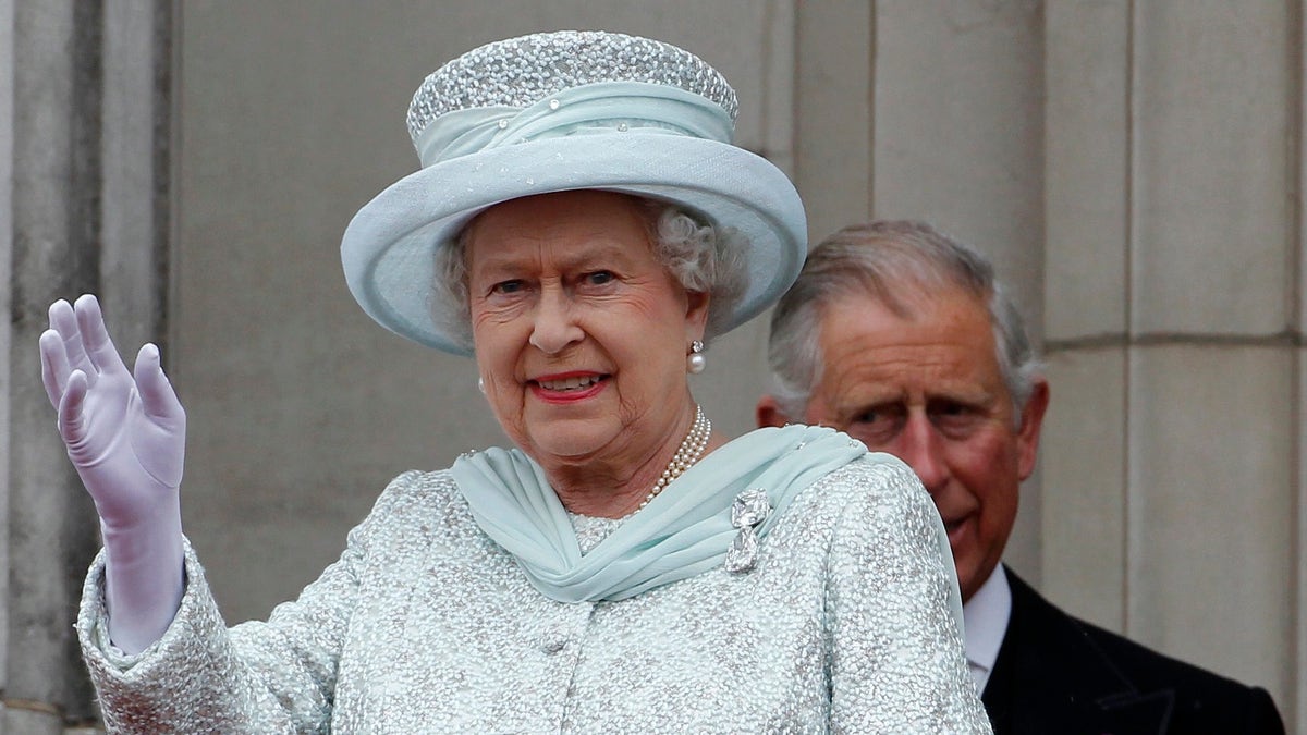 Britain's Queen Elizabeth waves from the balcony at Buckingham Palace during the Diamond Jubilee celebrations in central London Tuesday June 5, 2012. Four days of nationwide celebrations during which millions of people have turned out to mark the Queen's Diamond Jubilee conclude on Tuesday with a church service and carriage procession through central London. (AP Photo/Stefan Wermuth, Pool)