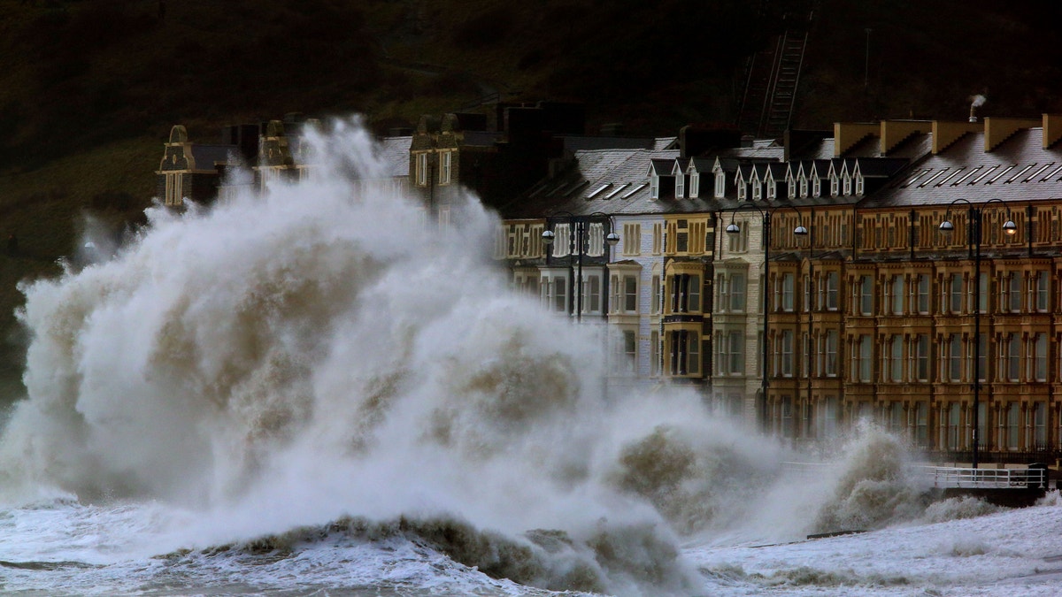 Jan. 6, 2014 - Waves crash against the Aberystwyth coastline in Wales, as strong winds and high tides continue to blow in from the west. Residents along Britain's coasts braced for more flooding as strong winds, rain and high tides lash the country.