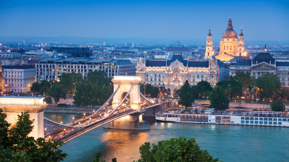 Panorama with Chain Bridge, St. Stephen's Basilica with lights in the evening in Budapest, Hungary