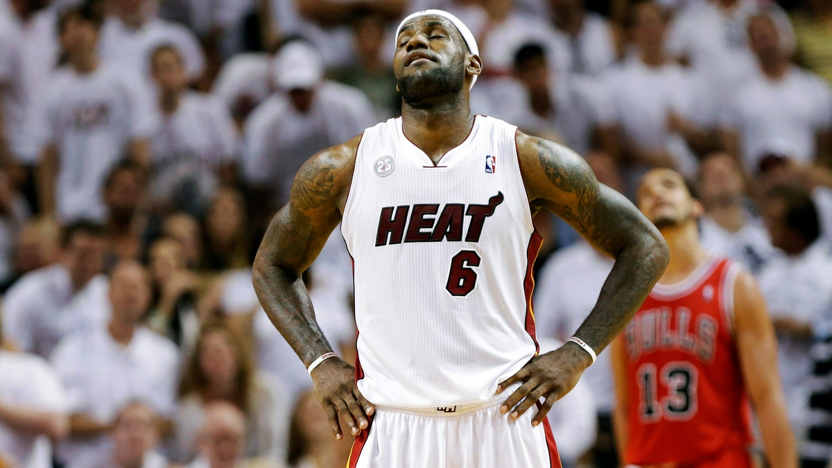 Miami Heat's LeBron James (6) reacts during the second half in Game 1 of their NBA basketball playoff series against the Chicago Bulls in the Eastern Conference semifinals, Monday, May 6, 2013, in Miami. The Bulls defeated the Heat 93-86. (AP Photo/Lynne Sladky)