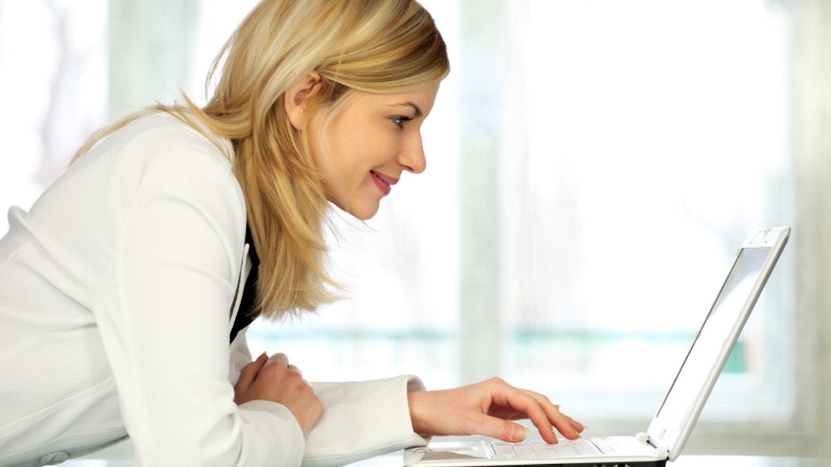 Woman with laptop.