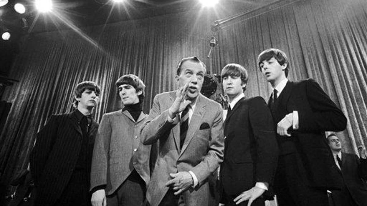 ** FOR USE AS DESIRED WITH BEATLES 45TH ANNIVERSARY ** In this Feb. 9, 1964 file photo, Ed Sullivan, center, stands with The Beatles during a rehearsal for the British group's first American appearance, on the 