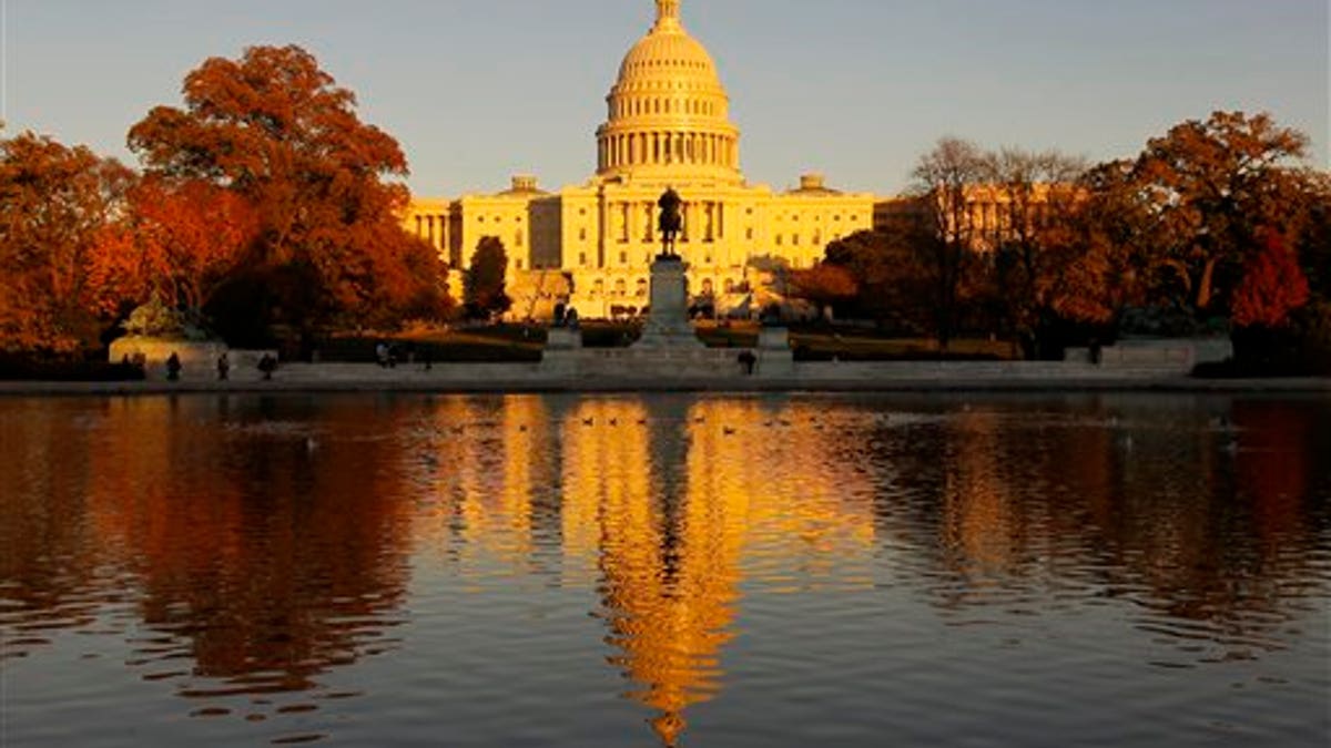 Capitol is shower in the United States at sunset and seen in the opposite group in the Capitol Hill in Washington, on Friday, November 12, 2010. Congress will return next week to a lame duck session after the elections. (AP Photo/Alex Brandon)