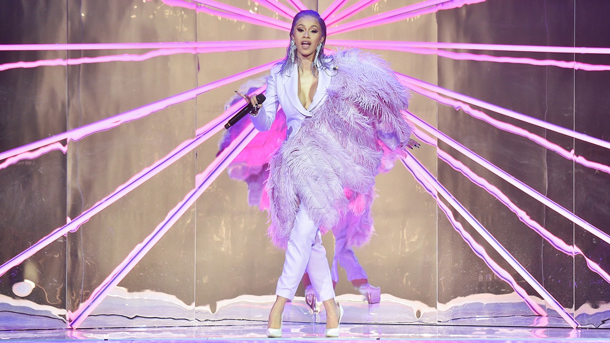 PARIS, FRANCE - SEPTEMBER 25:  Cardi B performs during the ETAM show as part of the Paris Fashion Week Womenswear Spring/Summer 2019 on September 25, 2018 in Paris, France.  (Photo by Stephane Cardinale - Corbis/Corbis via Getty Images)